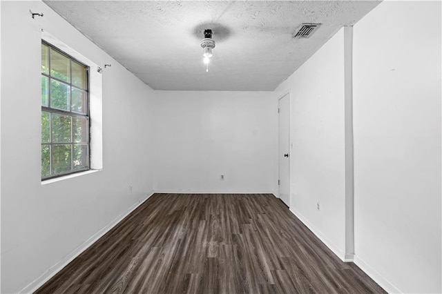 315 Pleasant Grove Rd, Mcdonough, GA 30252 - empty room featuring wood finished floors, a textured ceiling, and baseboards