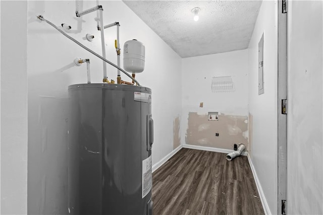 315 Pleasant Grove Rd, Mcdonough, GA 30252 - washroom featuring water heater, a textured ceiling, dark wood finished floors, washer hookup, and baseboards