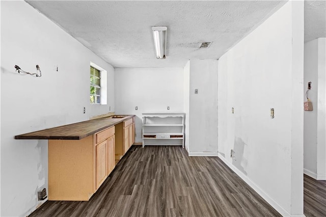 315 Pleasant Grove Rd, Mcdonough, GA 30252 - laundry room with dark wood-type flooring, a textured ceiling, and baseboards