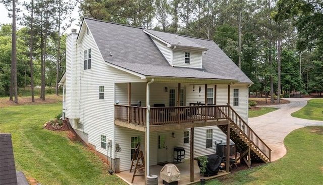 10 Stagg Trce, Social Circle, GA 30025 - view of front of house with a front lawn, a patio, a deck, and stairs