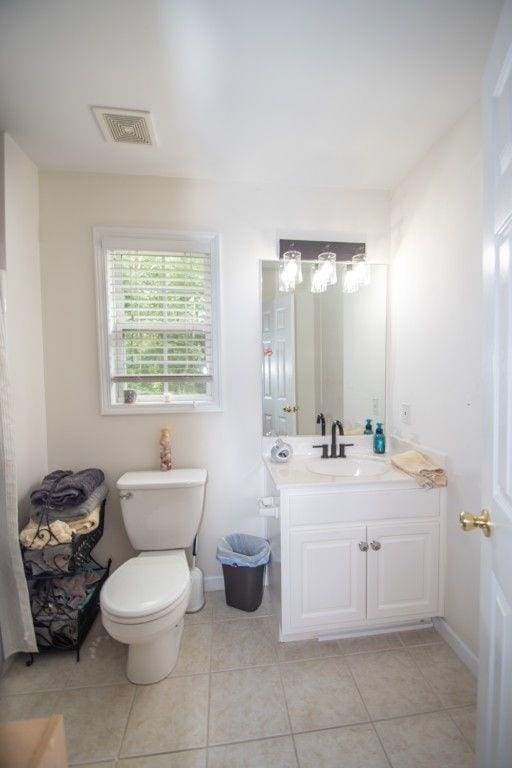 10 Stagg Trce, Social Circle, GA 30025 - bathroom featuring vanity, tile patterned floors, toilet, and baseboards
