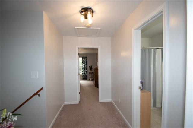 10 Stagg Trce, Social Circle, GA 30025 - hall featuring carpet flooring, an upstairs landing, baseboards, and attic access
