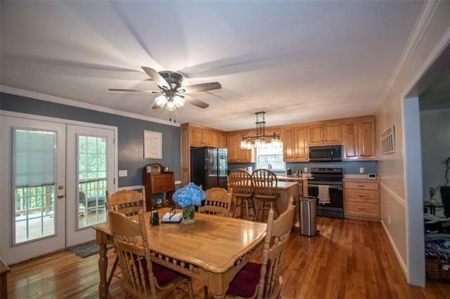 10 Stagg Trce, Social Circle, GA 30025 - dining space featuring french doors, a chandelier, wood finished floors, a ceiling fan, and ornamental molding