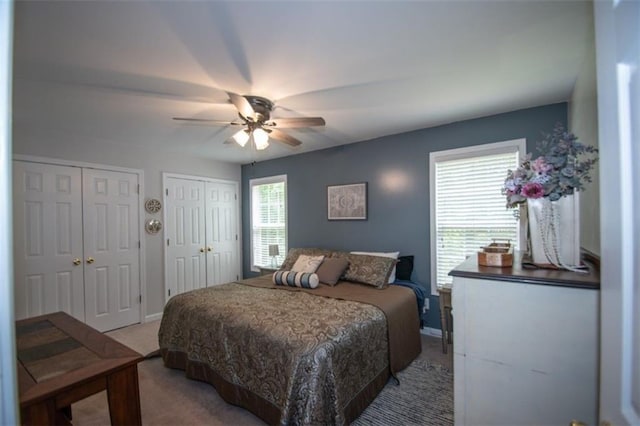10 Stagg Trce, Social Circle, GA 30025 - bedroom featuring light carpet, two closets, baseboards, and ceiling fan