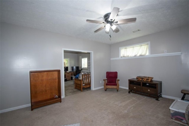 10 Stagg Trce, Social Circle, GA 30025 - sitting room featuring ceiling fan, carpet flooring, baseboards, and a textured ceiling