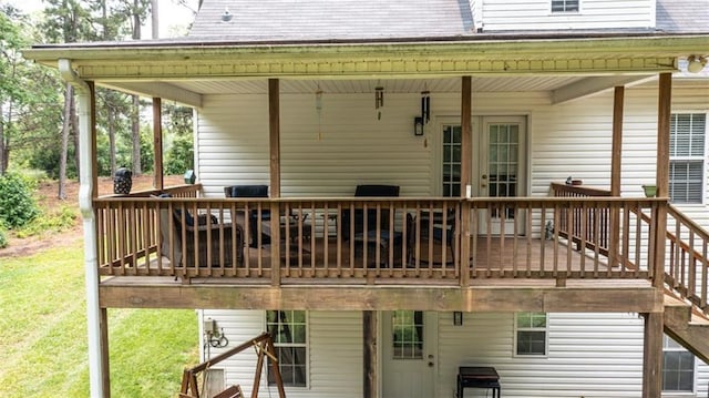 10 Stagg Trce, Social Circle, GA 30025 - back of property with a wooden deck, a shingled roof, and a yard