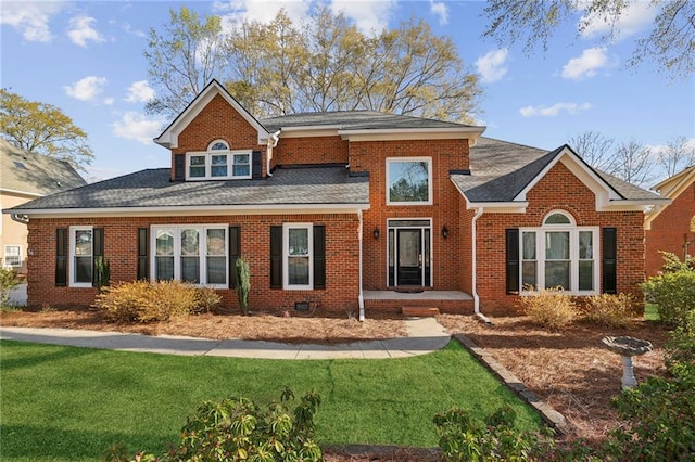 321 Covered Bridge Pl SW, Smyrna, GA 30082 - view of front of home featuring a front lawn, brick siding, and a shingled roof