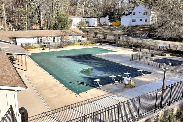 view of swimming pool featuring a patio area