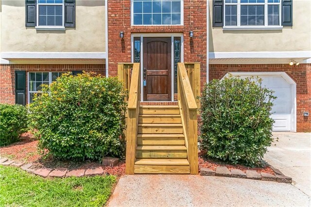 entrance to property featuring a garage