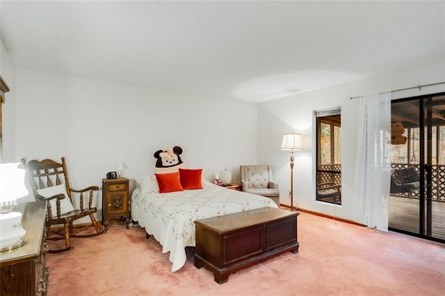 bedroom with carpet floors and access to outside