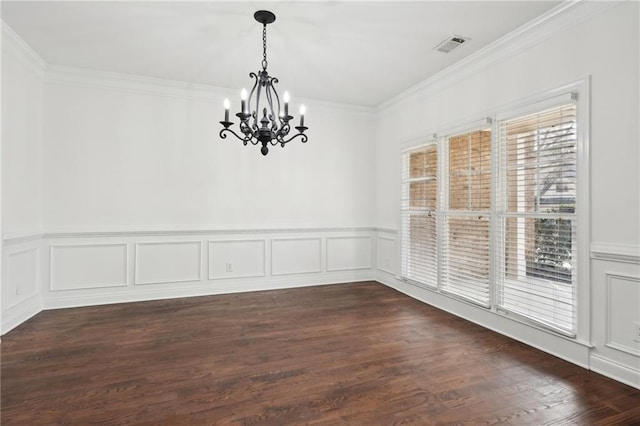 empty room with visible vents, ornamental molding, and dark wood-type flooring