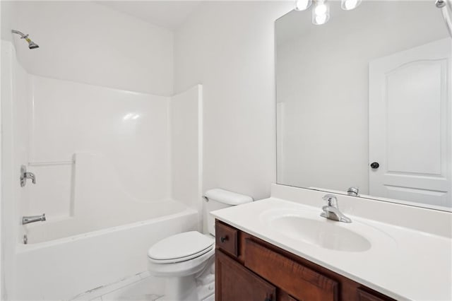 bathroom featuring bathing tub / shower combination, vanity, and toilet