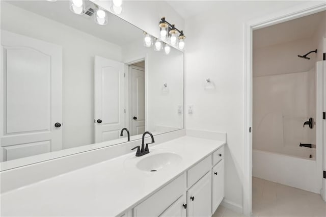 bathroom with vanity, bathing tub / shower combination, and tile patterned floors