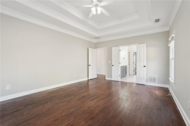 unfurnished bedroom featuring visible vents, dark wood finished floors, and baseboards