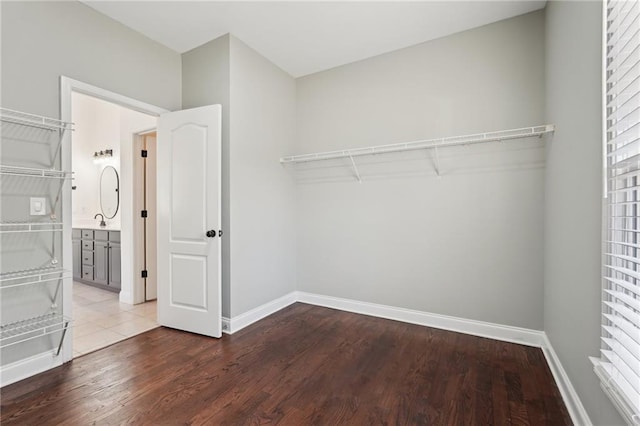 spacious closet with wood finished floors