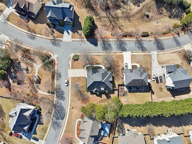 birds eye view of property with a residential view