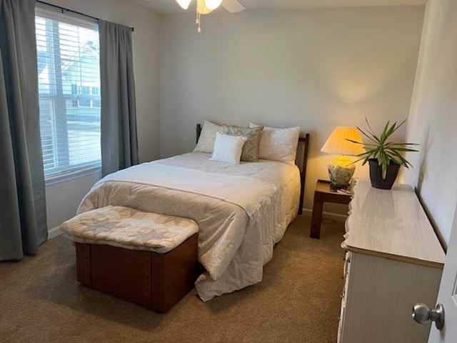 bedroom with carpet floors, multiple windows, and ceiling fan