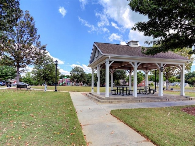 surrounding community featuring a yard, playground community, and a gazebo