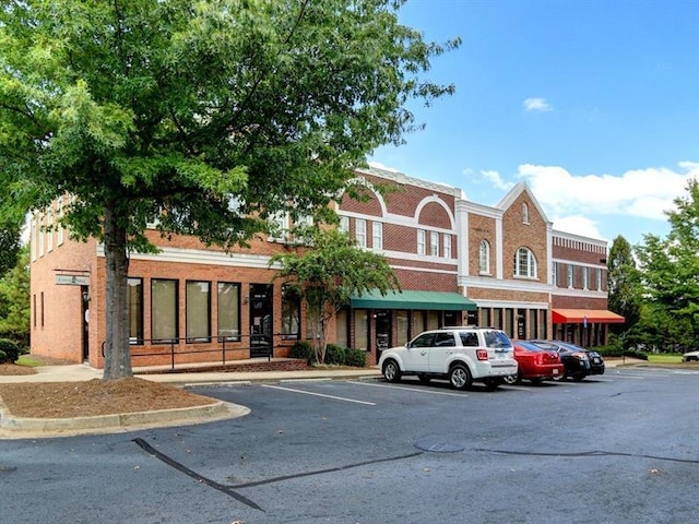 view of property featuring uncovered parking