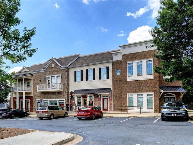 view of property featuring uncovered parking