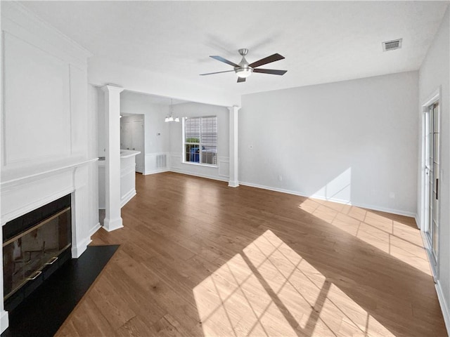 3968 Oak Glenn Dr, Duluth, GA 30096 - unfurnished living room featuring a ceiling fan, a glass covered fireplace, wood finished floors, and baseboards