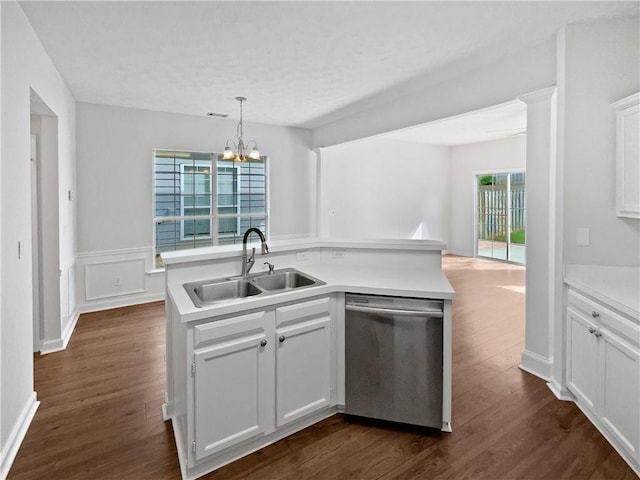 3968 Oak Glenn Dr, Duluth, GA 30096 - kitchen featuring stainless steel dishwasher, a sink, a chandelier, dark wood-style flooring, and light countertops
