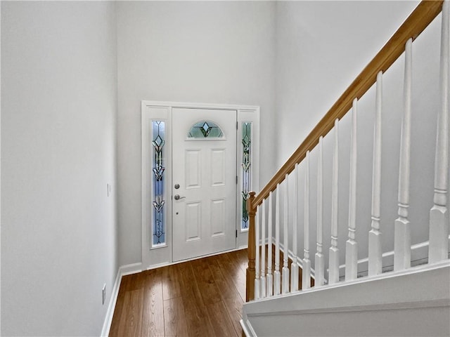 3968 Oak Glenn Dr, Duluth, GA 30096 - entryway featuring hardwood / wood-style floors, a high ceiling, baseboards, and stairs