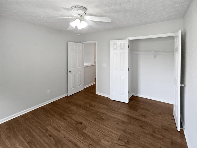 3968 Oak Glenn Dr, Duluth, GA 30096 - unfurnished bedroom with wood finished floors, a closet, baseboards, a ceiling fan, and a textured ceiling