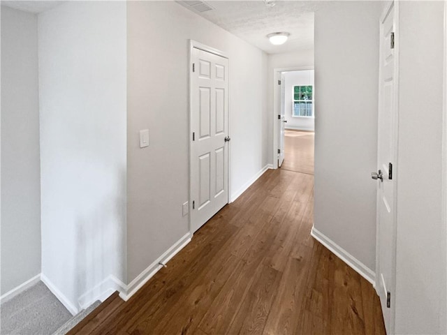3968 Oak Glenn Dr, Duluth, GA 30096 - hallway featuring baseboards and dark wood-style floors