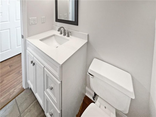 3968 Oak Glenn Dr, Duluth, GA 30096 - bathroom with toilet, vanity, and wood finished floors