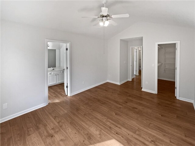 3968 Oak Glenn Dr, Duluth, GA 30096 - spare room featuring a ceiling fan, baseboards, vaulted ceiling, and wood finished floors