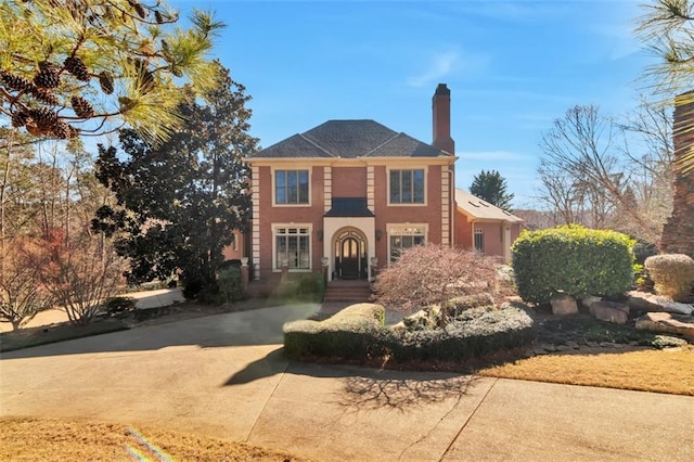 view of front of house with a chimney