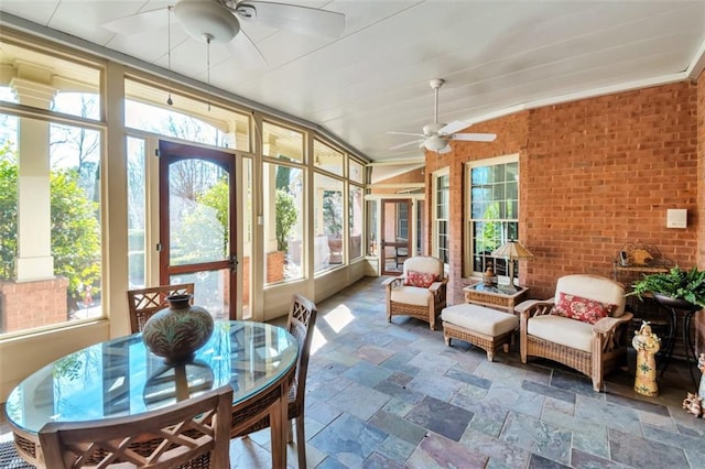 sunroom featuring ceiling fan