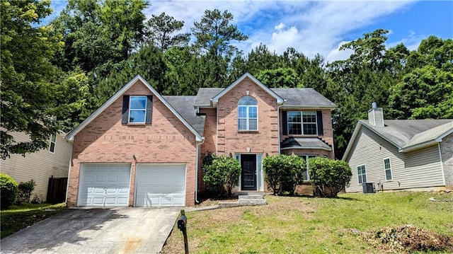 3881 Micah Ln, Ellenwood, GA 30294 - traditional-style home with concrete driveway, brick siding, a front lawn, and an attached garage