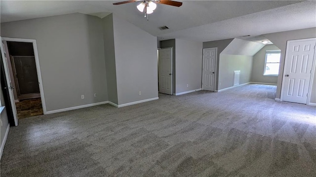 3881 Micah Ln, Ellenwood, GA 30294 - additional living space featuring vaulted ceiling, ceiling fan, carpet floors, and baseboards