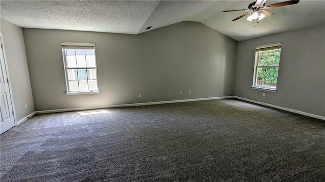 3881 Micah Ln, Ellenwood, GA 30294 - spare room featuring ceiling fan, vaulted ceiling, carpet, and baseboards