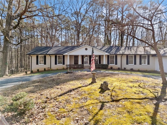 ranch-style home featuring brick siding