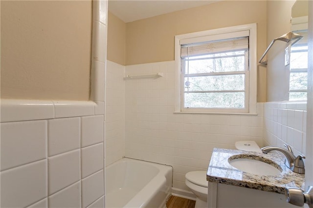 3018 Meadowview Dr SE, Atlanta, GA 30316 - bathroom with vanity, a wealth of natural light, tile walls, and toilet