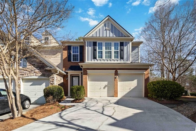 view of front of home with concrete driveway, an attached garage, brick siding, and board and batten siding