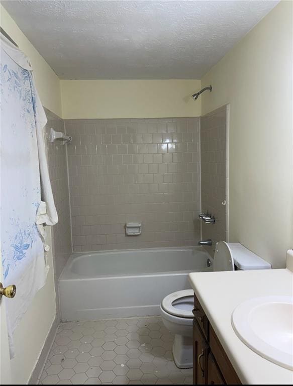 7123 Williamsburg Dr, Riverdale, GA 30274 - full bath with bathing tub / shower combination, tile patterned floors, vanity, and toilet