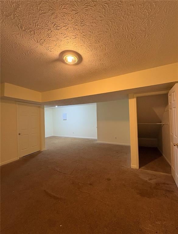 7123 Williamsburg Dr, Riverdale, GA 30274 - finished basement featuring baseboards, carpet flooring, and a textured ceiling