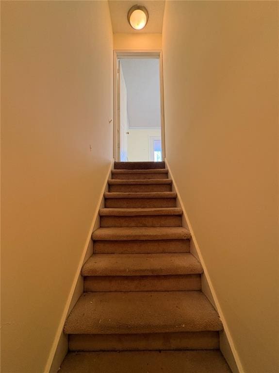 7123 Williamsburg Dr, Riverdale, GA 30274 - stairs featuring baseboards and carpet