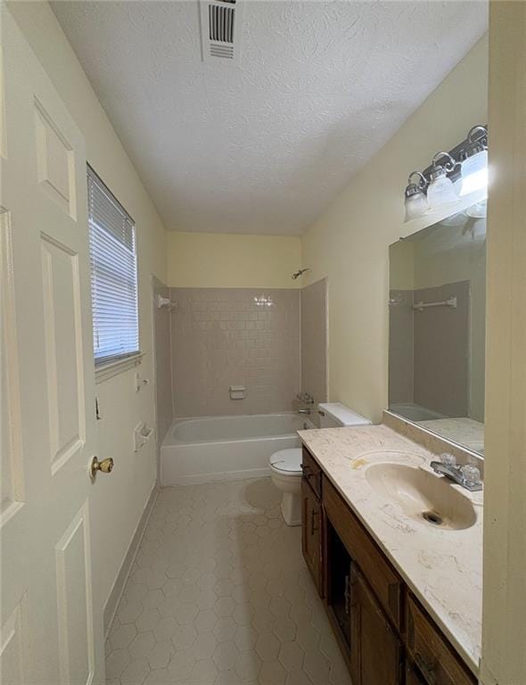 7123 Williamsburg Dr, Riverdale, GA 30274 - full bathroom featuring a textured ceiling, vanity, shower / tub combination, visible vents, and toilet