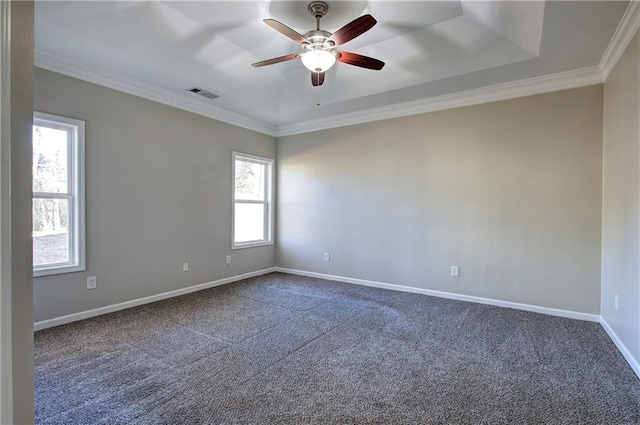 carpeted empty room featuring ceiling fan, plenty of natural light, and crown molding