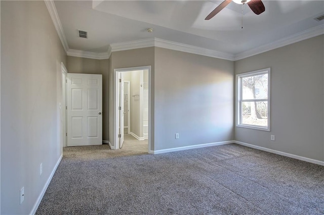 unfurnished bedroom with ceiling fan, carpet floors, ensuite bathroom, and ornamental molding