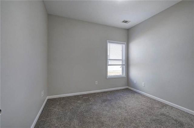 unfurnished room featuring carpet