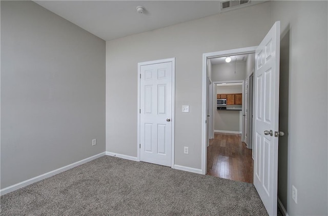 unfurnished bedroom featuring carpet