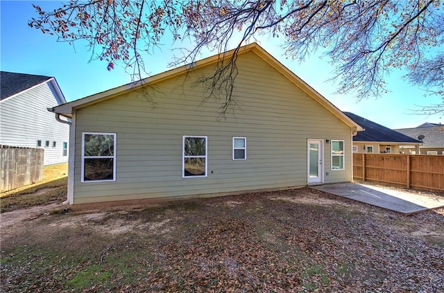 back of house with a patio