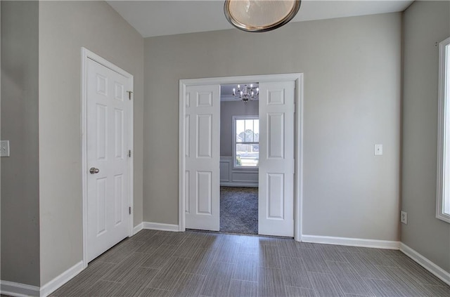 entryway featuring a notable chandelier