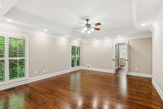 spare room featuring a raised ceiling, ceiling fan, wood finished floors, ornamental molding, and recessed lighting